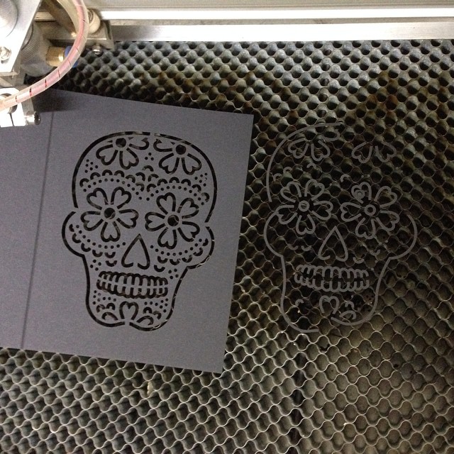 Taking a break from customer orders to laser-cut more skull cards in preparation for Halloween. #diadelosmuertos #backinstock