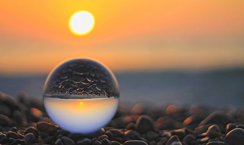sunset beach sun orange glassball sea landscape rocks nature light art crystalball