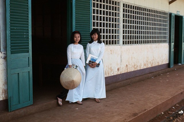 Vietnamese School Girls in their school uniform, a white Ao Dai.  1968