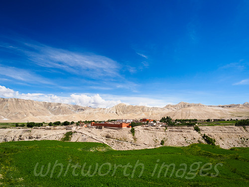 city blue nepal sky brown green nature clouds contrast landscape outdoors town asia village desert wheat capital scenic dry nobody nopeople scene hills oasis crop fields mustang himalaya arid walledcity restrictedarea uppermustang lomanthang annapurnaconservationarea