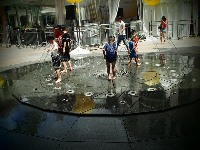 Street Photography -Playing with water (Pin Hole Effect)