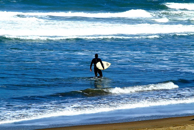 Ocean Beach surfer, San Francisco, CA, USA.