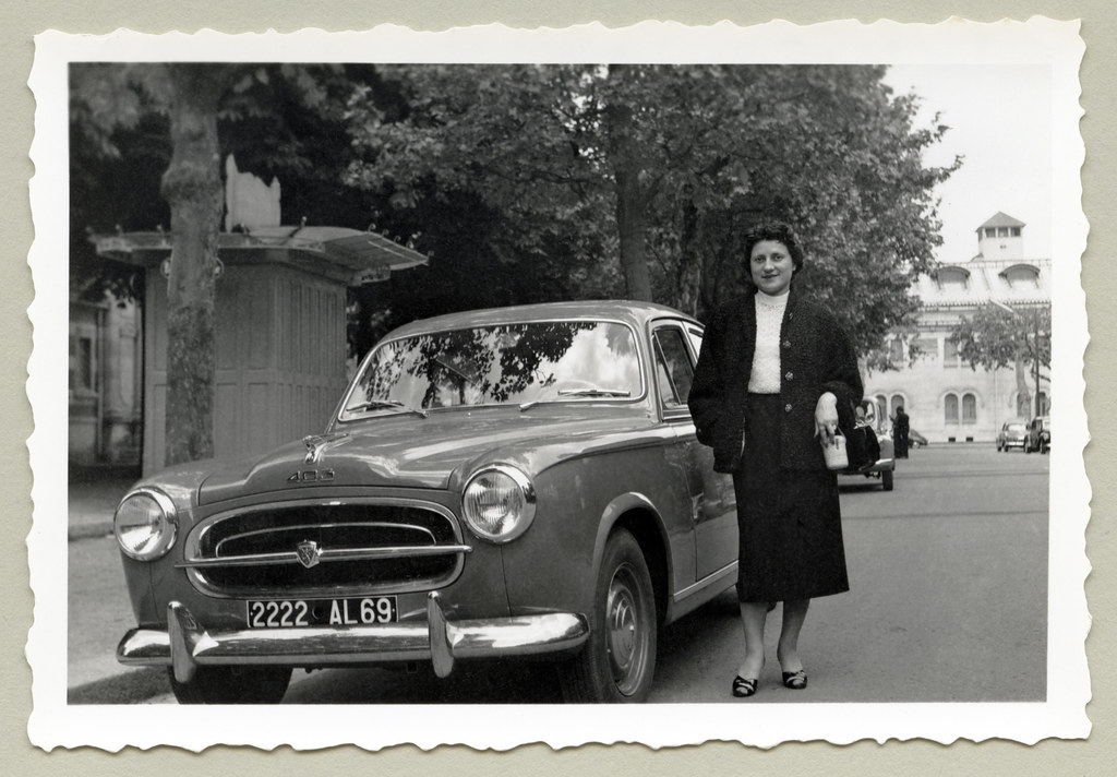 Peugeot 403 | A lady dressed in a female suit posing with a … | Flickr