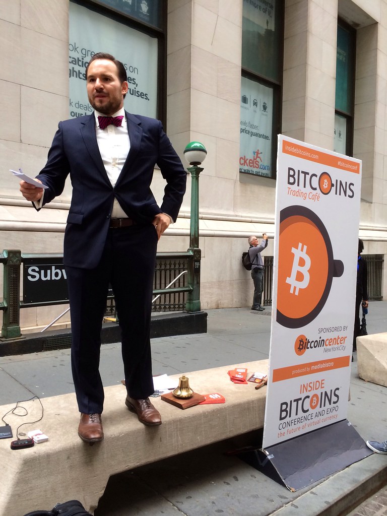 A live Bitcoin auction taking place across from the NYSE.