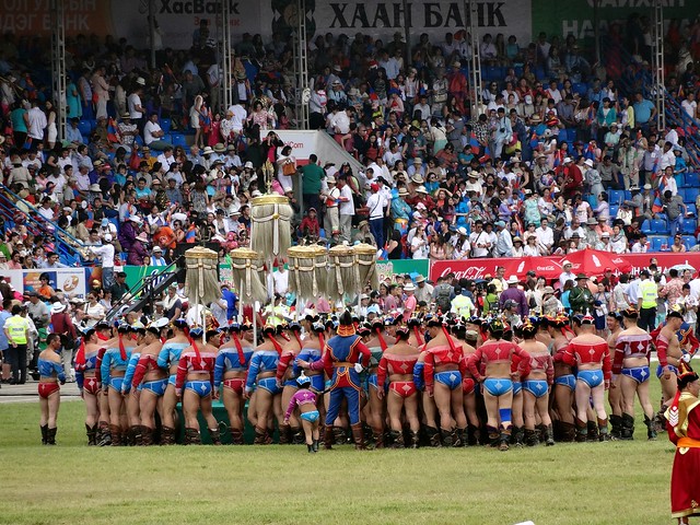 Wrestlers around the Yak Tail Banners just after the opening Ceremony Naadam Ulaanbaatar Mongolia