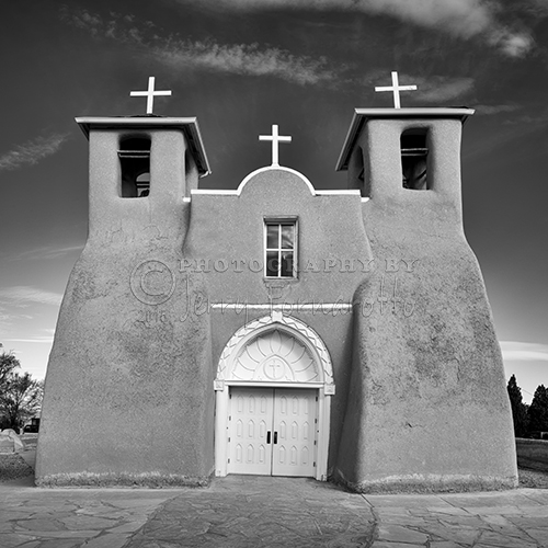 door old travel blackandwhite newmexico southwest building church monochrome rural mono blackwhite catholic outdoor religion rustic culture landmark courtyard monochromatic historic belltower steeple mexican adobe western crucifix mission taos spiritual sanctuary stucco crossed frontview buttress asis arctitecture sanfranciscodeasis sonya7r jerryfornarotto