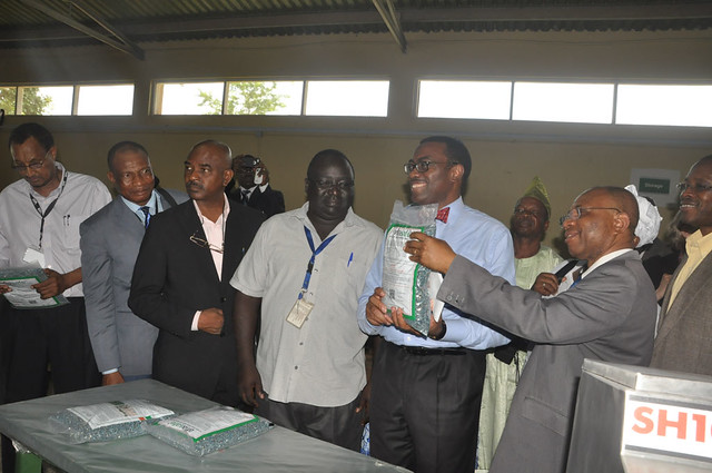 Dr. Akinwumi Adesina poses with pack of Aflasafe