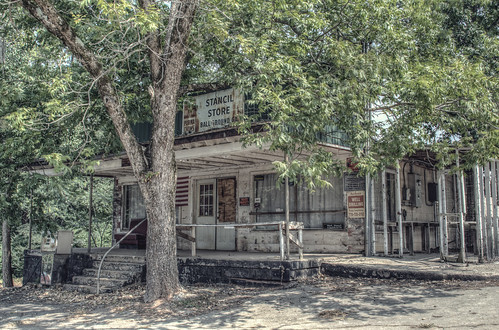 old trees usa building abandoned architecture rural vintage georgia store nikon closed unitedstates decay south country rusty architectural gasstation southern faded adobe boardedup generalstore frontporch derelict mica shady smalltown gaspump lightroom countrystore cherokeecounty ballground stancilsstore d7000 stgrundy