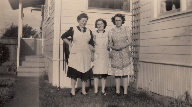 Three women in aprons