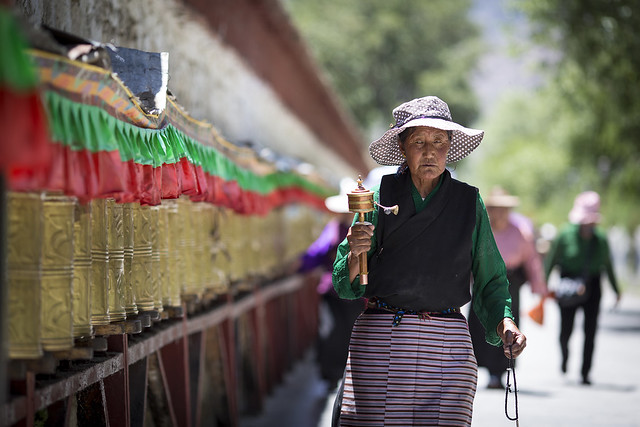 Prayer Wheel Lady in Lhasa Tibet