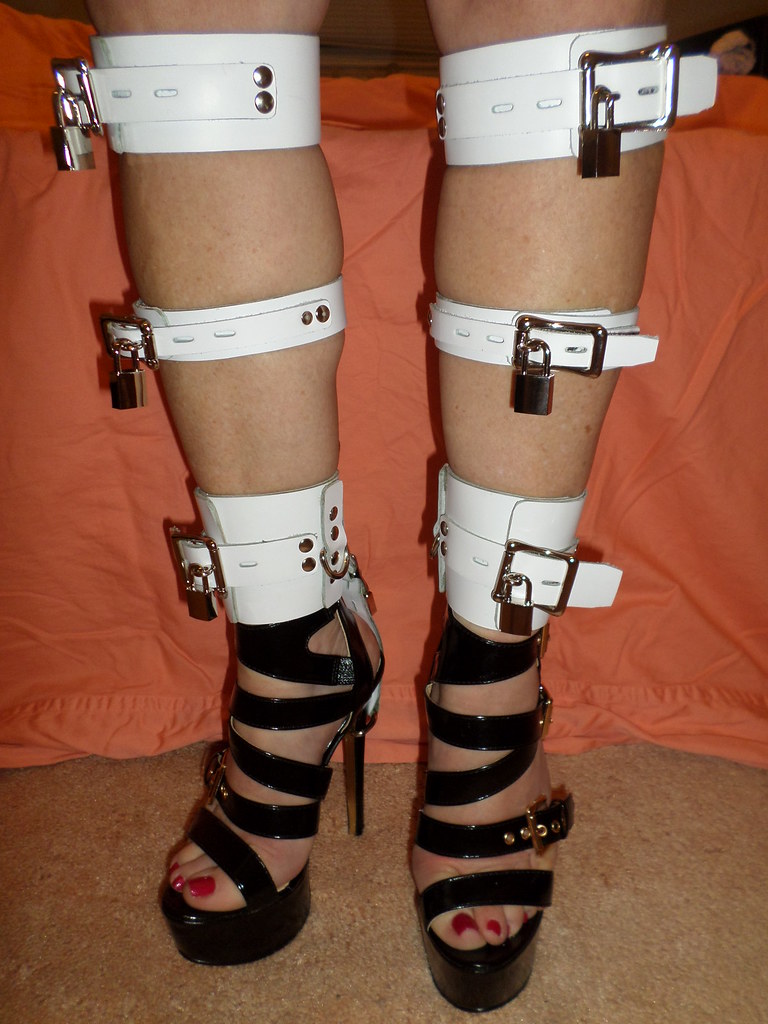 Made to measure leg braces and custom made leather and metal bondage gear a...