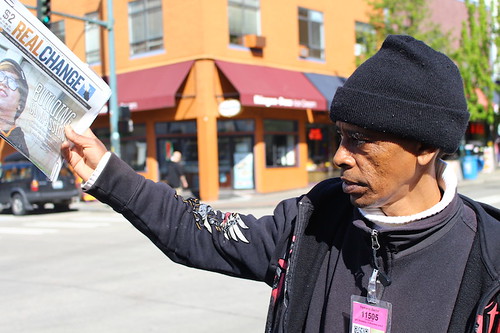 Yemane Berhe, a vendor at Real Change News, sells newspapers for some income on University Way Northeast while he, an immigrant from Eritrea, remains homeless in Seattle.