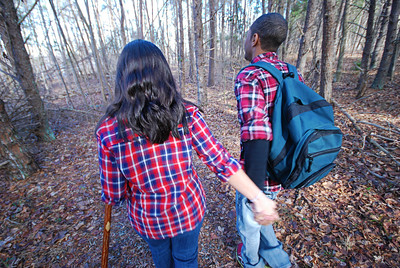 photo of a couple hiking along a trail