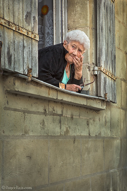 Elderly Woman Looking out Window