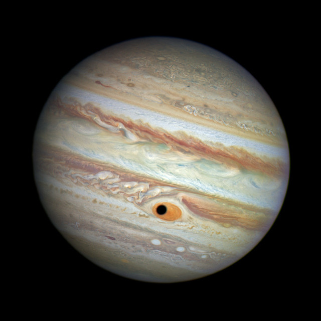 Hubble Spies Spooky Shadow on Jupiter's Giant Eye (color)