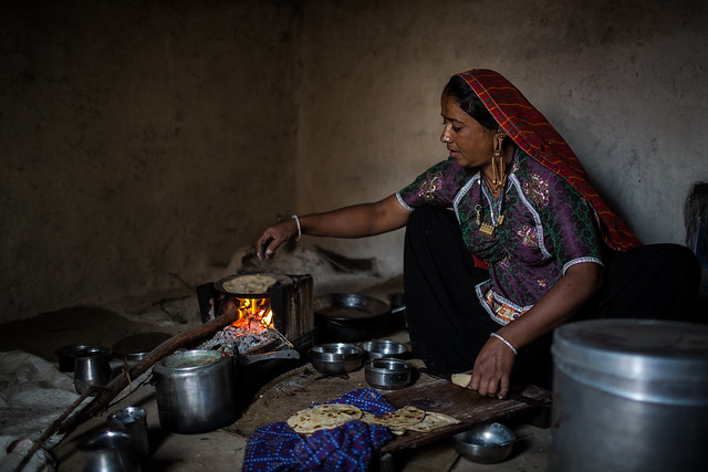 Rabari tribe woman cooking chapatis in the great rann of kutch