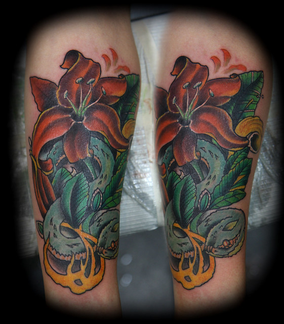 Flower and snake tattoo