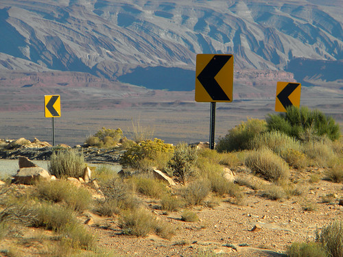 One of a hundred warnings about sharp turns ahead on Moki Dugway, a gravel road with lots of hairpin turns (Utah, USA)