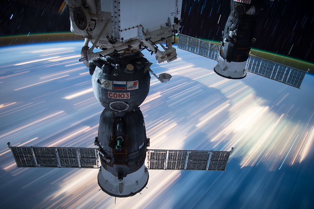 Soyuz Capsules Over the Earth