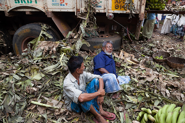 Men resting after a hard day of work at the wholesale market in Kolkata, India.