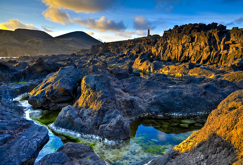sunset sea cliff lighthouse portugal water rock landscape island volcano lava nikon europe outdoor hill serene farol seashore tidepools atlanticocean hdr eruption azores rockformation faial capelinhos 24120mm domar d700 vulcãodoscapelinhos