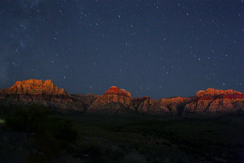 Red canyon cliffs under a starry sky outside Las Vegas