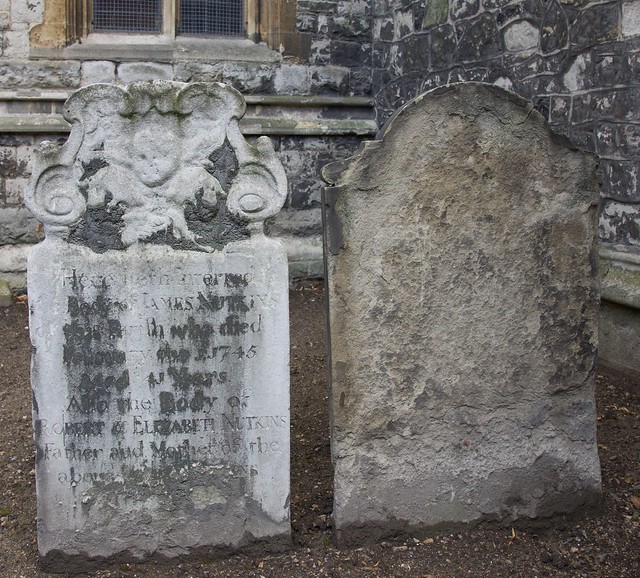 Weathered gravestones by the West Door