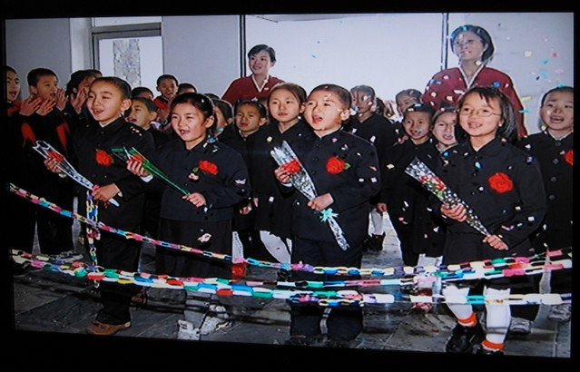 North Korean kids w/roses ...