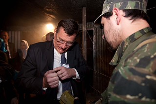 John Harrison from KPMG under the watchful eye of the guard at the Refugee Run