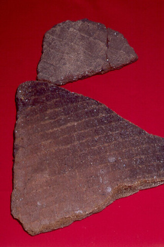 Latte ware or Marianas Plain refers to pottery not decorated or slipped pottery.  These sherds have a woven basket or mat surface texture.

Guam Museum/Judy Flores