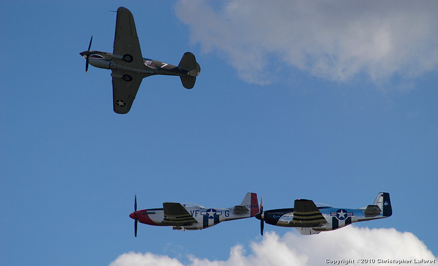 P40 and P51 Mustangs in formation 25