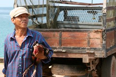Chicken-carrying man, Koh Kood Pier