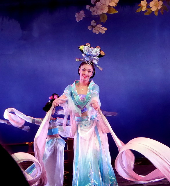 LOVELY CHINESE LADIES DANCING AND MAKING WONDERFUL PATTERNS WITH THEIR LONG SLEEVES AND WANDS OF SILK.     TANG OPERA SHOW,  XI'AN, CHINA