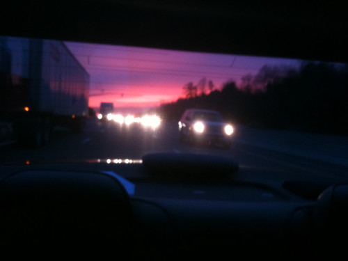 pink sunset sky car clouds highway driving purple interstate