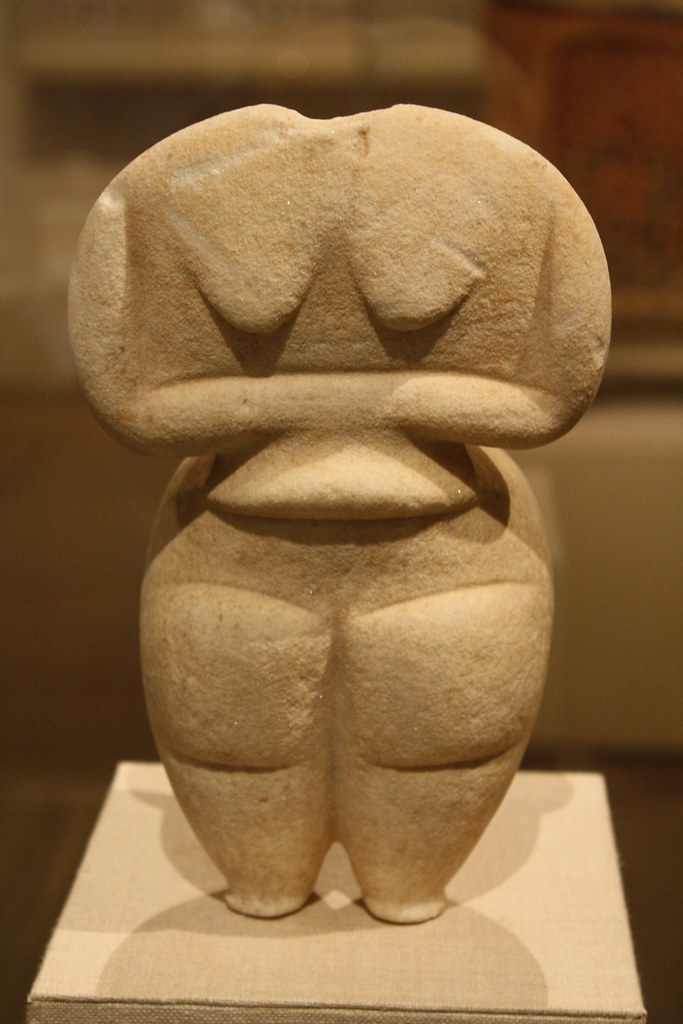 A Highly Important Neolithic Cycladic Female Standing Marble Idol of Steatopygous Type