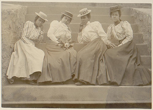 [Four African American women seated on steps of building at Atlanta University, Georgia] (LOC)