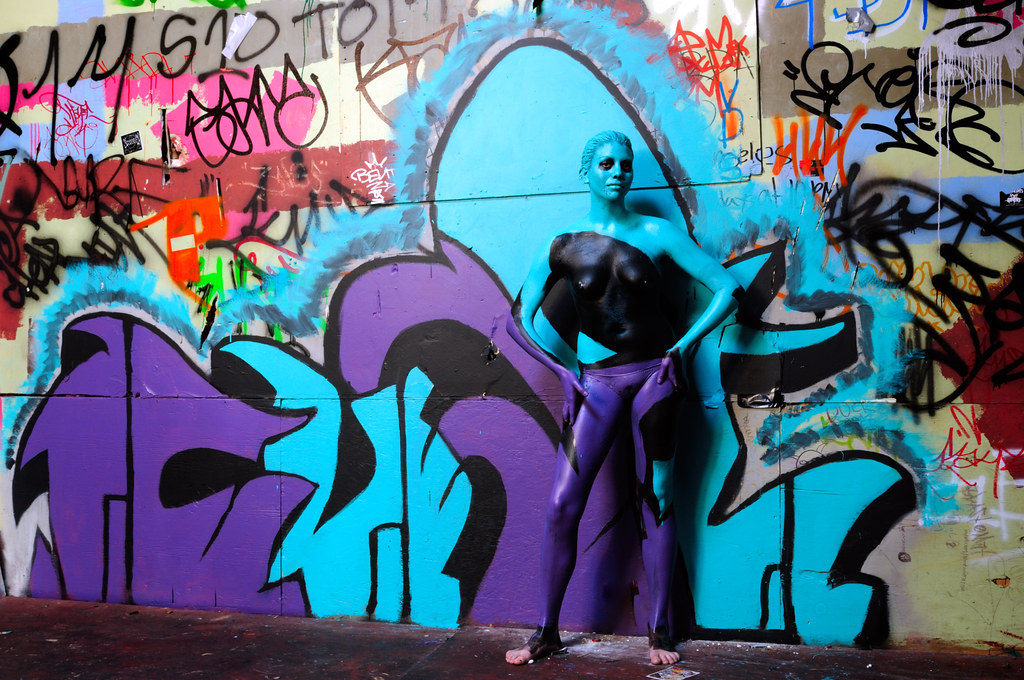 Meet the hot graffiti artist who poses naked with her work viral army