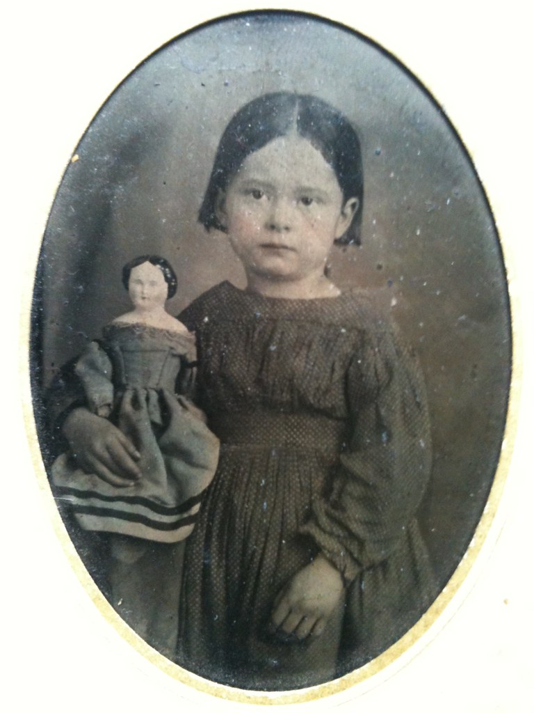 Girl with doll in blue dress tintype