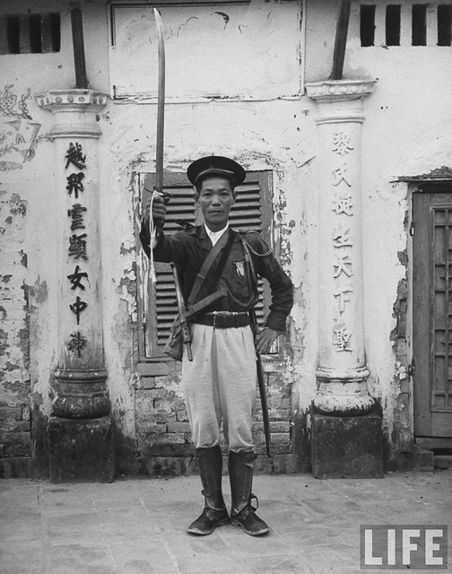 1948 - French Indo China Tran Dang Man lifting his sword in token of shift of allegiance to French.