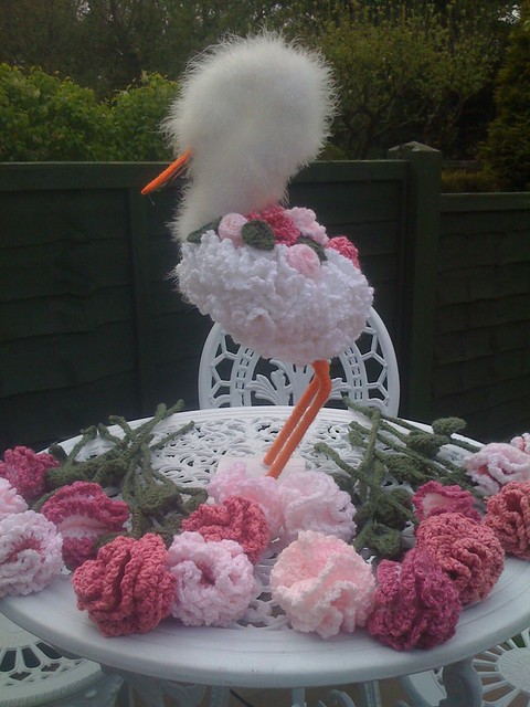 Stork and Carnations in the Garden on a Summer's Day.