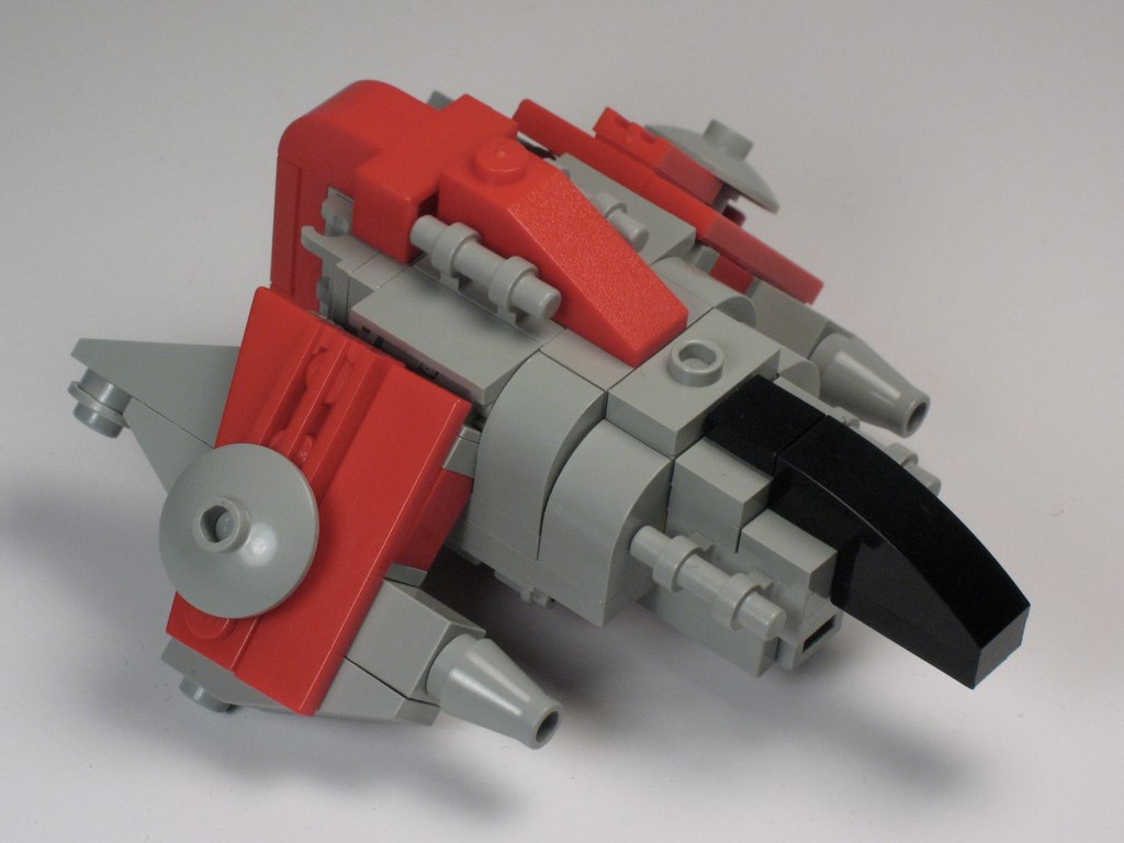 A towering capital ship fills a space dock while a tiny fighter rests beside its landing gear. A towering capital ship fills a space dock while a tiny fighter rests beside its landing gear.