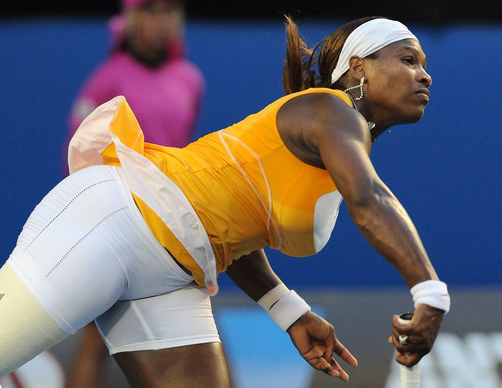 Serena Williams of the US serves against Justine Henin of Belgium in their ...