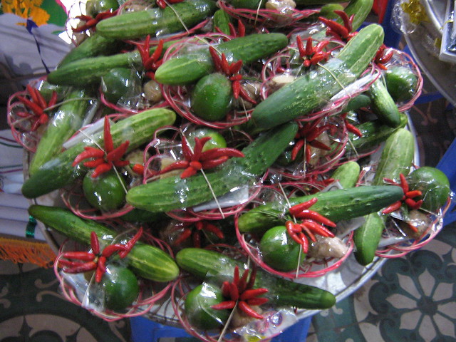 Cucumber and chilli offerings inside Dam temple