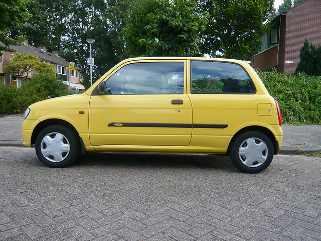 Yellow Daihatsu Curore - 2000