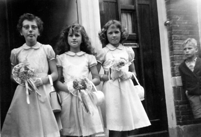 three bridesmaids , standing in front of the house (number 82) of the happy couple to be (and that is pretty soon from now : Wiet ten Wolde and Katrien Vink) , in the Willem Kuijperstraat in Scheveningen/Den Haag/The Hague in the year 1956    -   HOLLAND