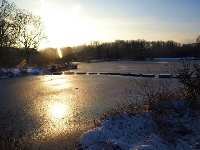 The pale winterly morning sun over the frozen Wurmauenpark Geilenkirchen/NRW, Germany