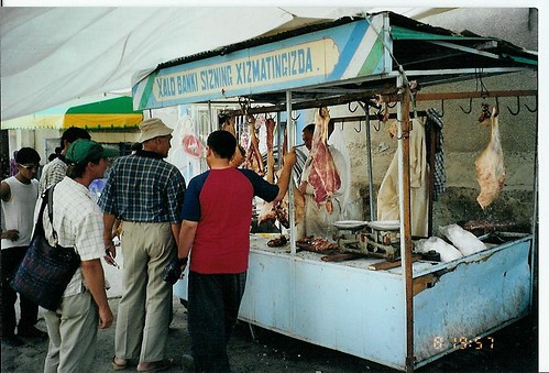Choosing Meat in Uzbakistan Market