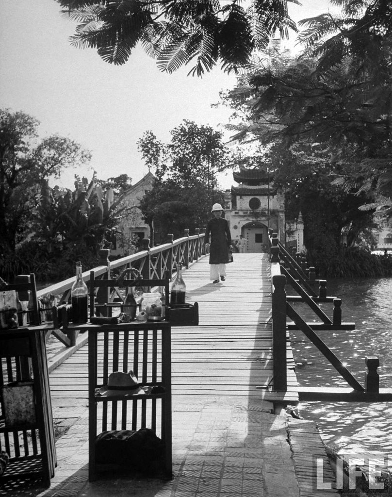 Hanoi 1948 - Man walking over an arched bridge, in French Indochina