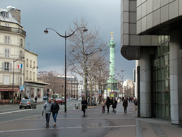 Rita Crane Photography:  Paris Street Scene / Place de la Bastille / people / buildings / architecture / French flag / L'Opera