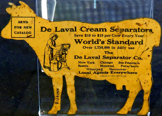 Vintage cow-shaped dairy farming equipment advertising postcard
